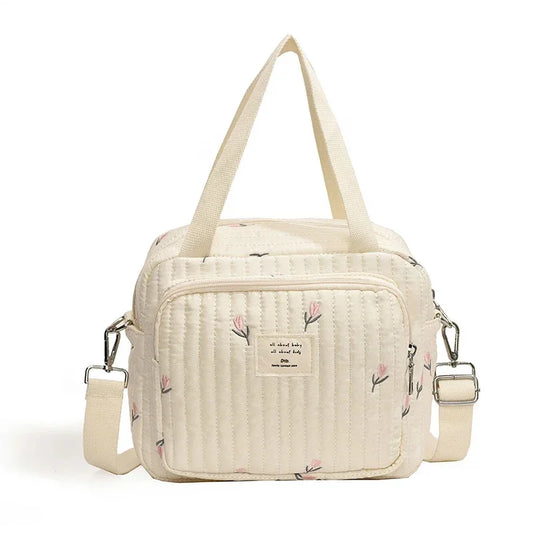 Petit sac à langer beige floral élégant et pratique