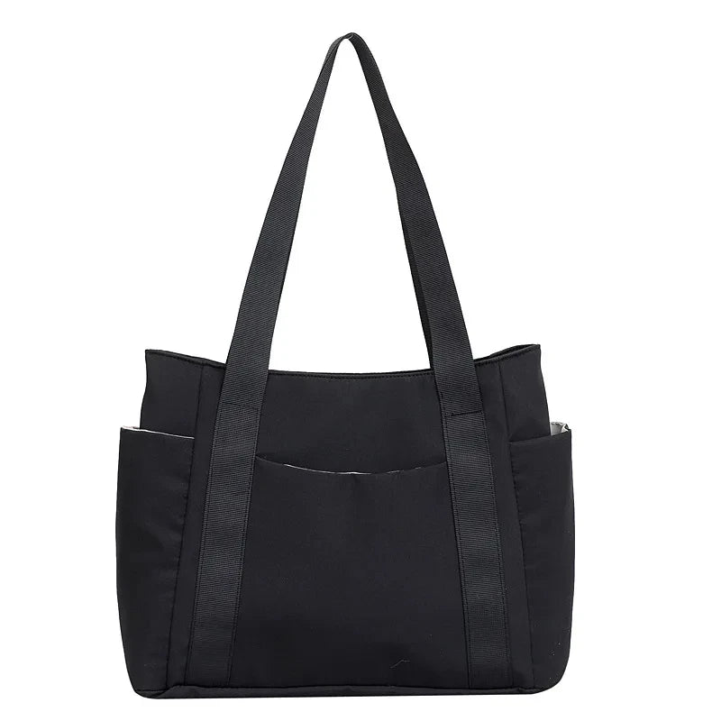 Sac à langer noir, rose ou violet élégant et pratique pour parents